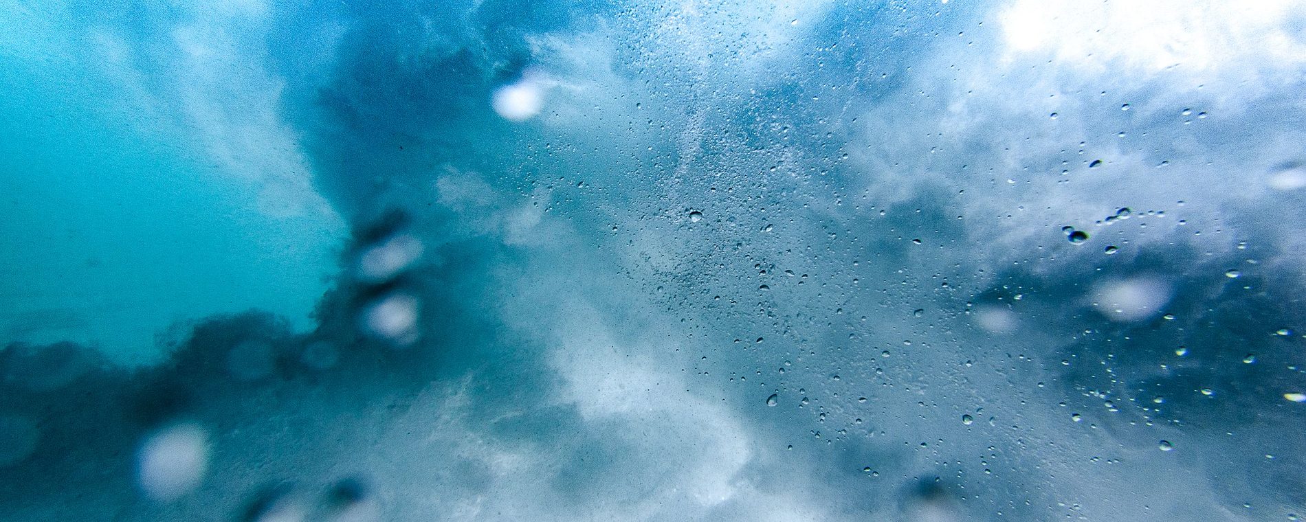 A bloom of blue water caught mid-splash