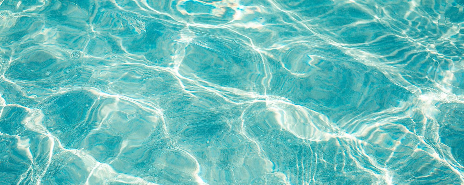 Sunlight caustics moving through clear water